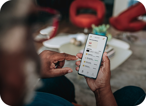 Person holding a smartphone and viewing transaction history in XEPPT’s customer portal app.